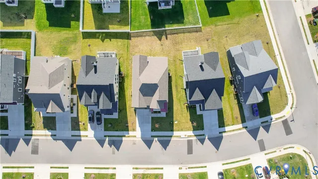 a view of a patio with a table and chairs under an umbrella