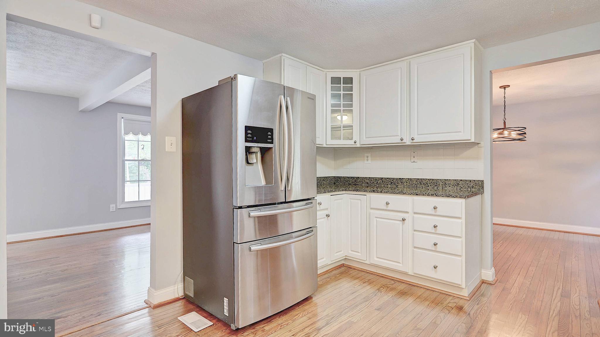 8500 Falling Leaf Road Springfield, VA 22153 - Photo 23 of 23 Open floor plan w/ view of living and dining room.
