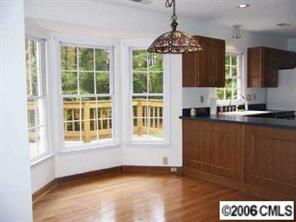 2267 Turnridge Court Fort Mill, SC 29708 - Photo 5 of 8 a view of kitchen with granite countertop cabinets and a wooden floor