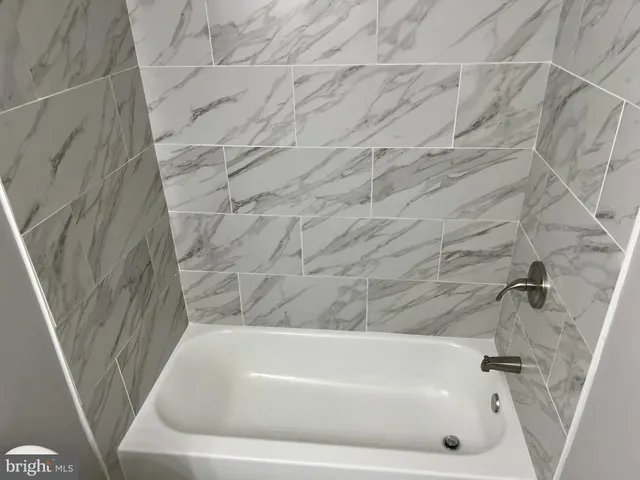 a utility room with a sink a toilet and vanity