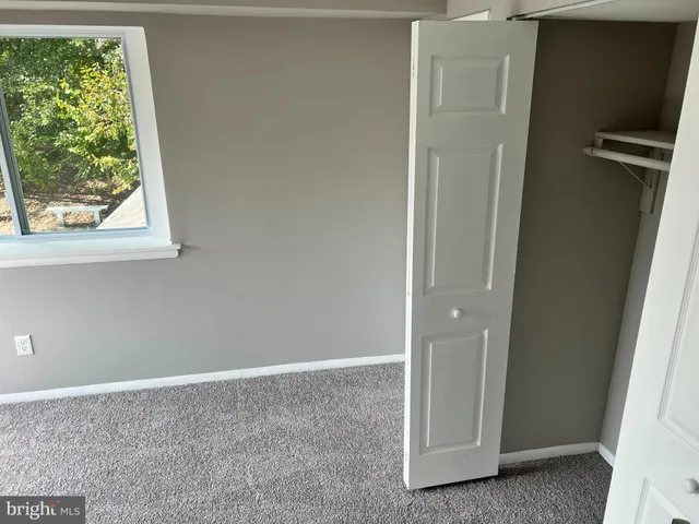 a view of room with hardwood floor