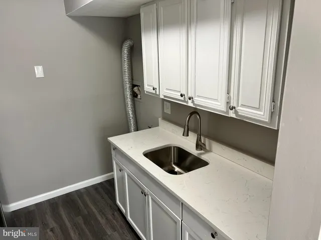 a kitchen with a stove and a microwave