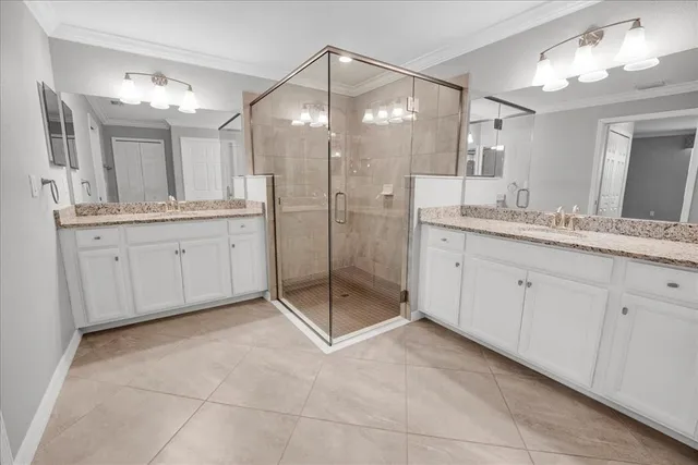 a bathroom with a granite countertop sink a toilet and a mirror