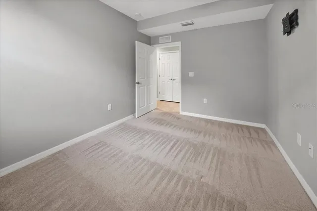 an aerial view of a swimming pool and outdoor seating