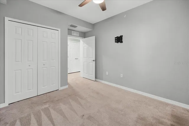 a very nice looking living room with furniture and floor to ceiling windows