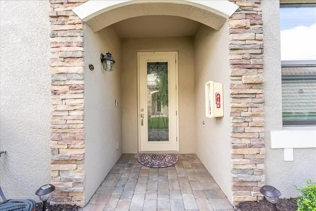 a kitchen with a sink a counter top space stainless steel appliances and cabinets