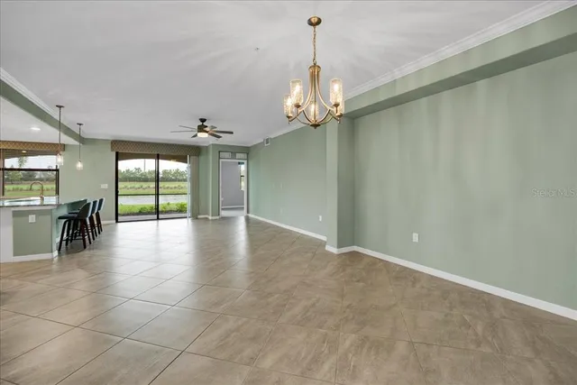 a view of a livingroom with a ceiling fan and window