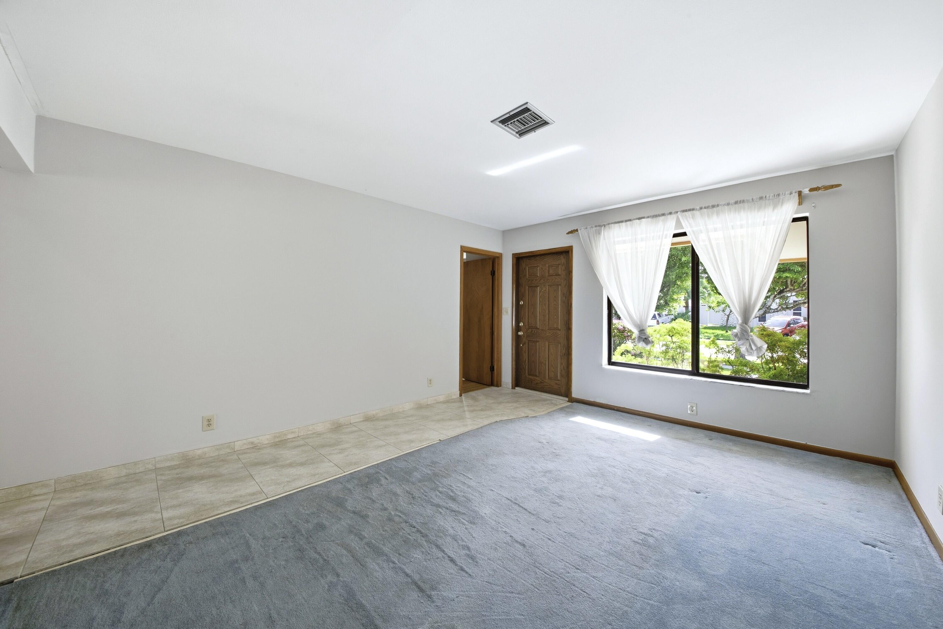 309 Southeast 4th Street Dania Beach, FL 33004 - Photo 4 of 23 an empty room with windows