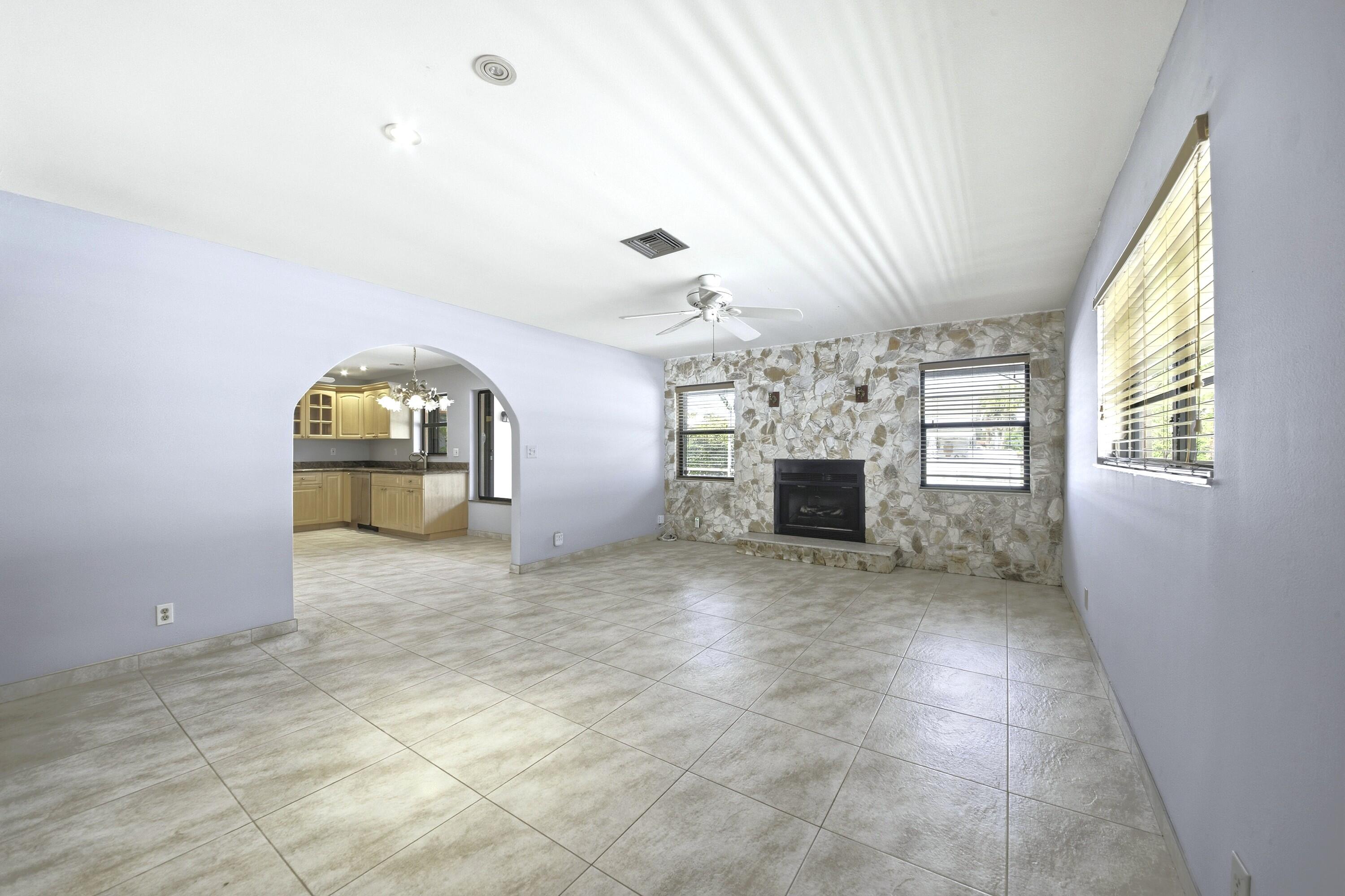 309 Southeast 4th Street Dania Beach, FL 33004 - Photo 9 of 23 a view of a livingroom with a fireplace and window