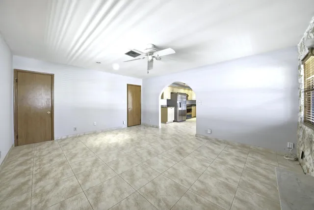 a view of an empty room and a window