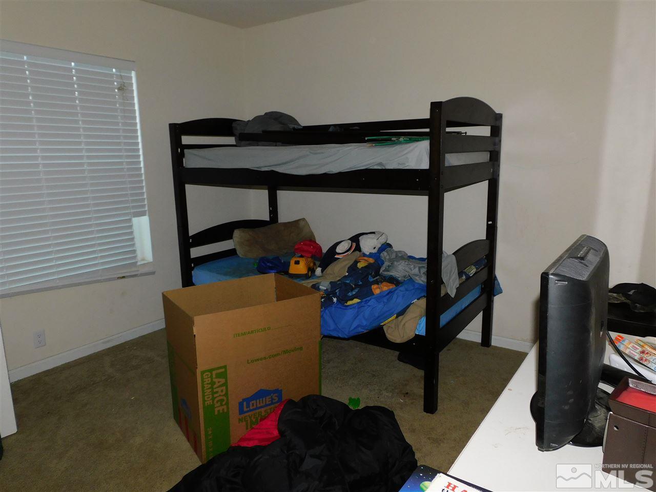 17875 Fantail Circle Reno, NV 89508 - Photo 11 of 15 a bedroom with furniture and a closet