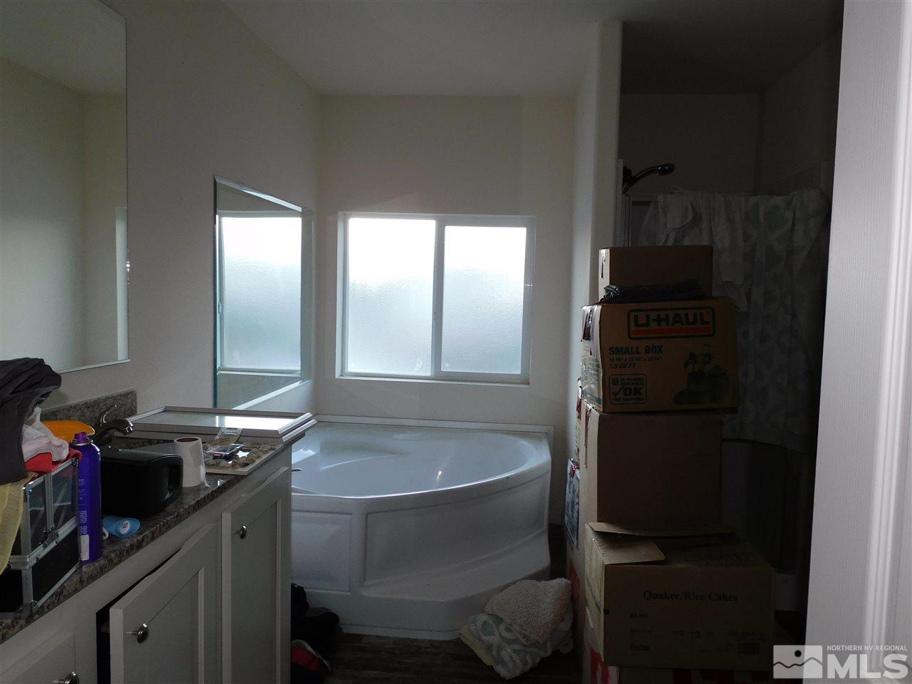 17875 Fantail Circle Reno, NV 89508 - Photo 12 of 15 a bathroom with a sink and a mirror