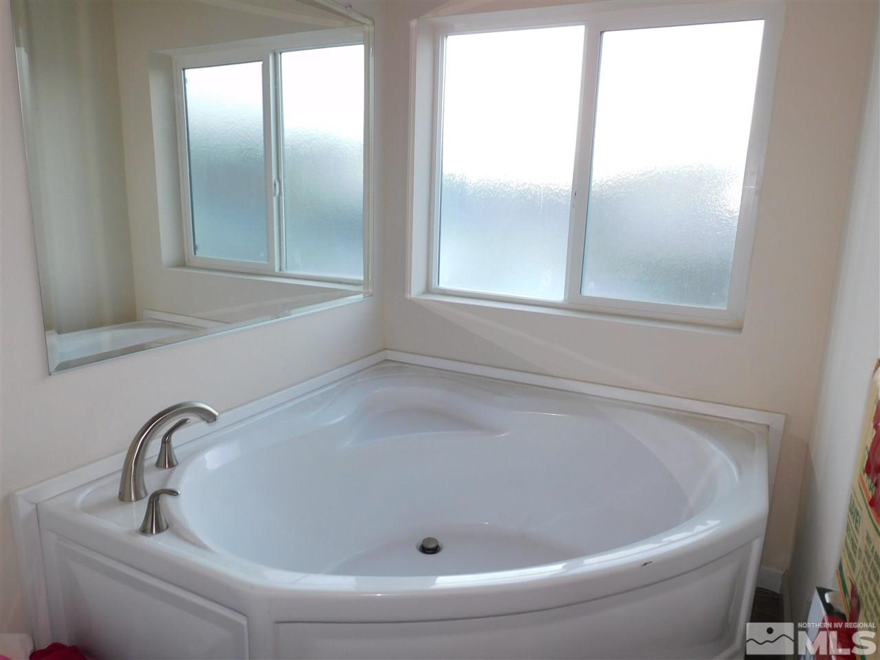 17875 Fantail Circle Reno, NV 89508 - Photo 13 of 15 a white bath tub sitting next to a window
