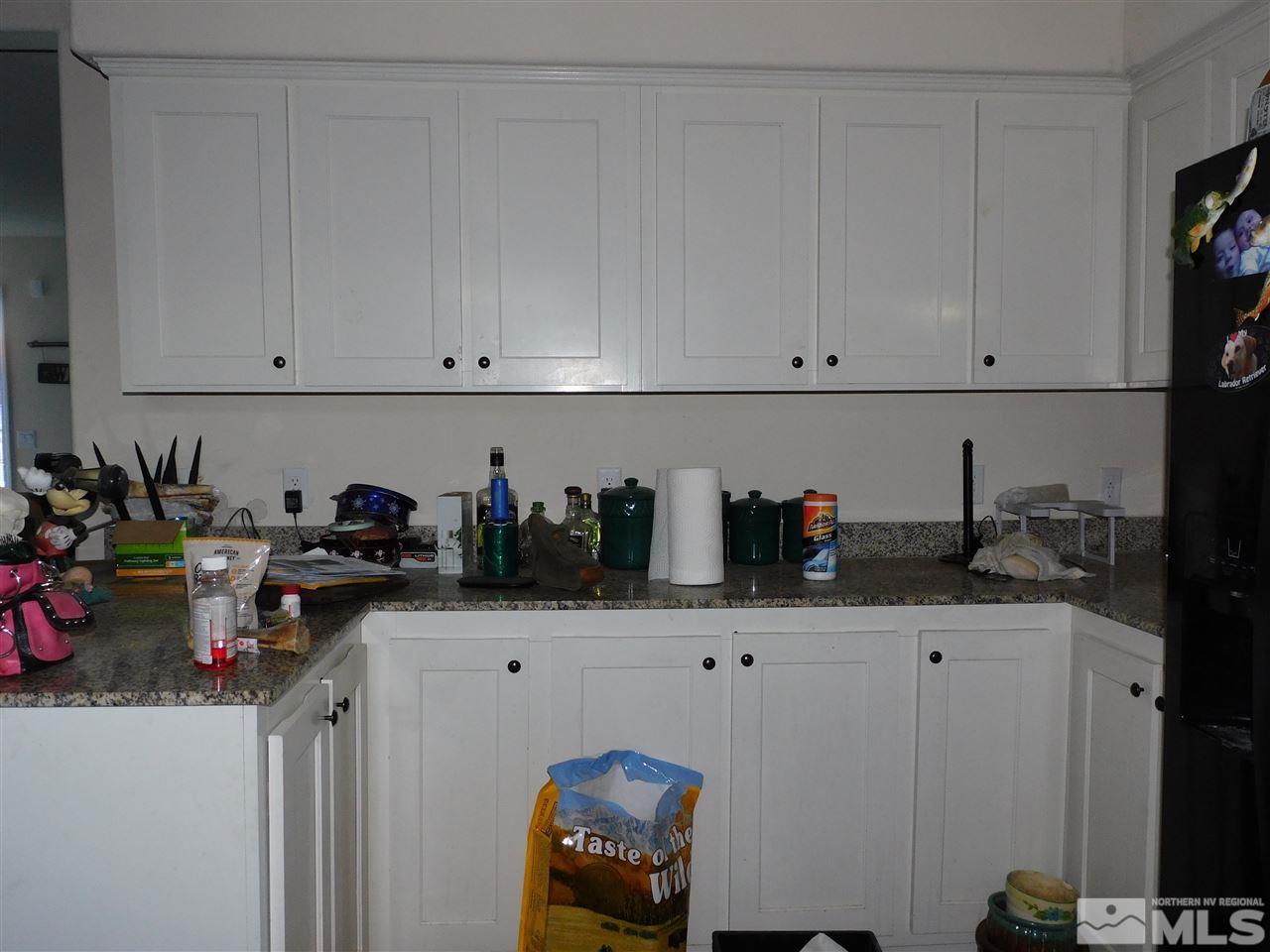 17875 Fantail Circle Reno, NV 89508 - Photo 5 of 15 a kitchen with a sink and cabinets