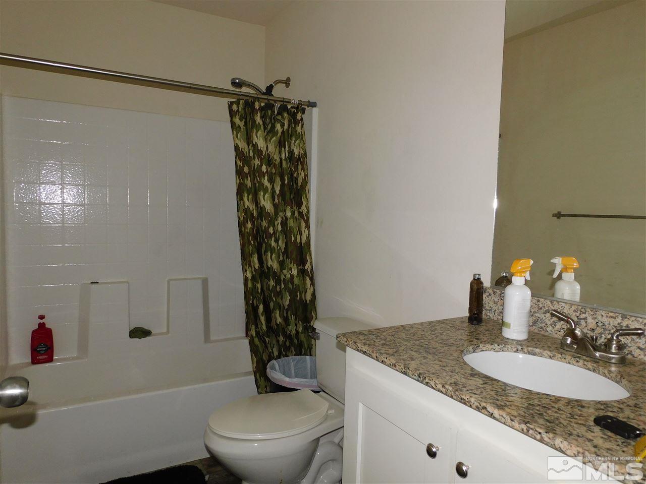 17875 Fantail Circle Reno, NV 89508 - Photo 10 of 15 a bathroom with a granite countertop sink toilet and shower