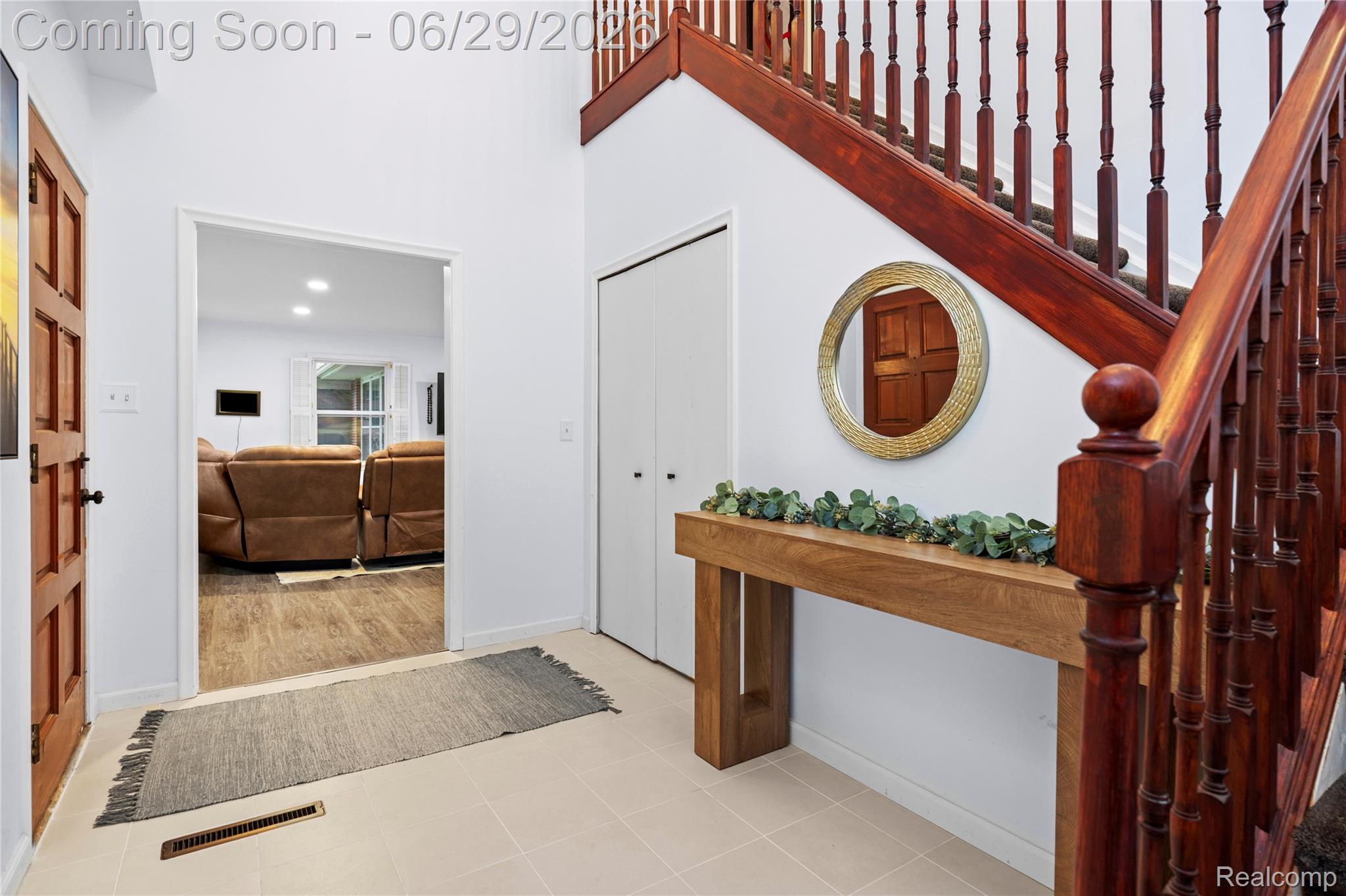 6085 Worlington Road Bloomfield Hills, MI 48301 - Photo 8 of 75 Entryway featuring light-toned tile flooring and a rich wood-finish staircase with turned balusters