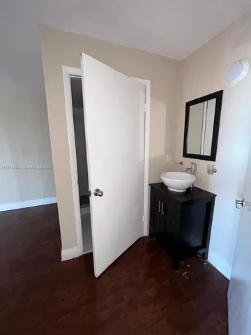 a view of a bathroom from a hallway