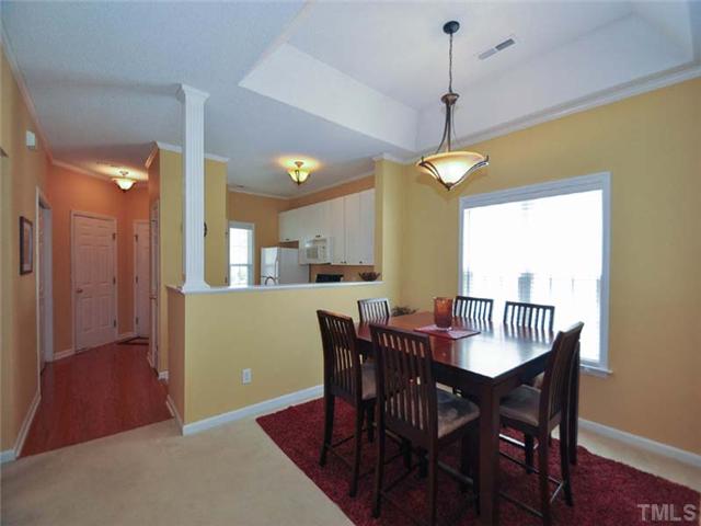 5325 Sahalee Way Raleigh, NC 27604 - Photo 5 of 25 Located perfectly between the living room and kitchen the dining area offers a beautiful trey ceiling and large window for natural lighting