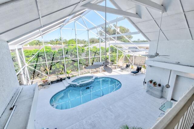 5125 Southeast Matousek Street Stuart, FL 34997 - Photo 16 of 39 a kitchen with a sink and a large window