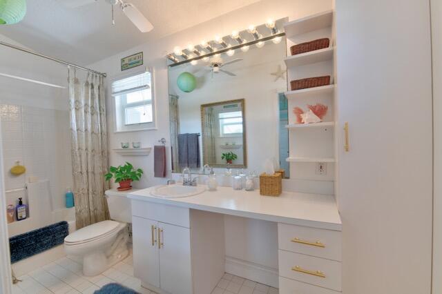 5125 Southeast Matousek Street Stuart, FL 34997 - Photo 22 of 39 a bathroom with a sink a toilet and shower