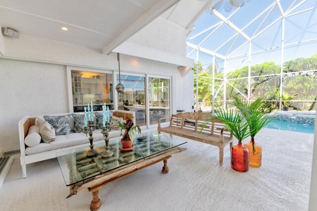 5125 Southeast Matousek Street Stuart, FL 34997 - Photo 24 of 39 a living room with furniture gym equipment and a potted plant