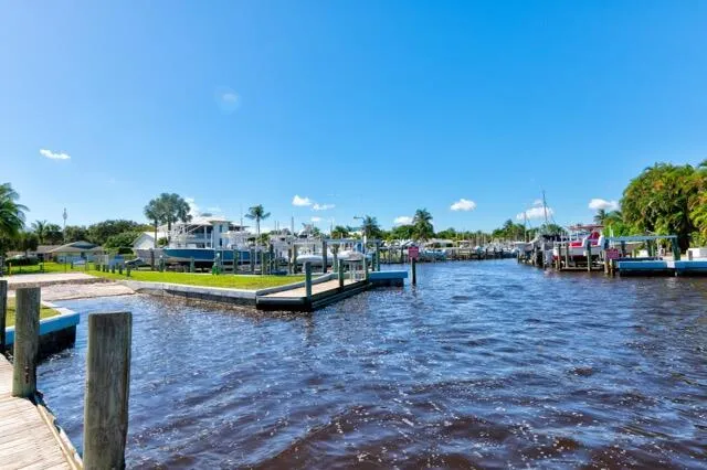 a view of swimming pool with outdoor seating and yard in back