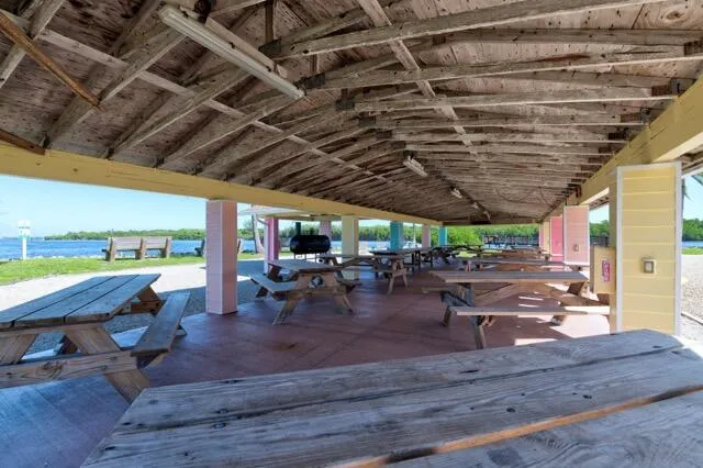 a view of a patio with table and chairs