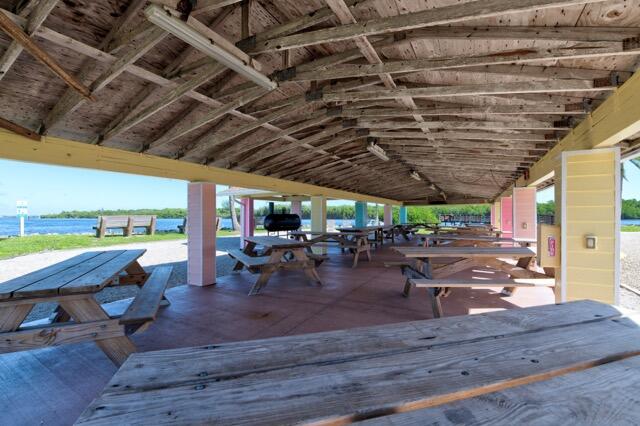 5125 Southeast Matousek Street Stuart, FL 34997 - Photo 34 of 39 a view of a patio with table and chairs