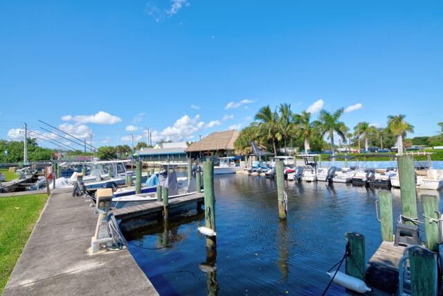 5125 Southeast Matousek Street Stuart, FL 34997 - Photo 39 of 39 a living room with lots of furniture and a garden