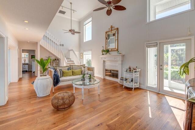 5125 Southeast Matousek Street Stuart, FL 34997 - Photo 5 of 39 a living room with furniture and a fireplace