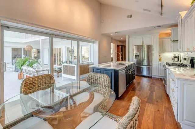 a living room with furniture wooden floor and a fireplace
