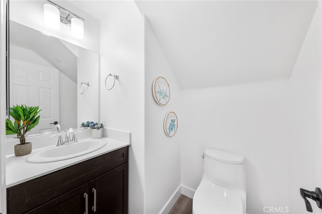 67 Plateau Irvine, CA 92618 - Photo 18 of 32 a bathroom with a toilet a sink and a mirror