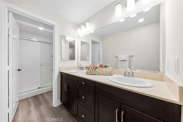 a bathroom with a double vanity sink and mirror