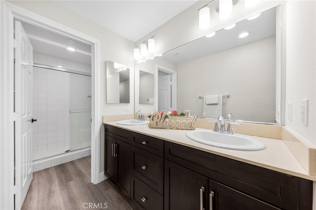 67 Plateau Irvine, CA 92618 - Photo 21 of 32 a bathroom with a double vanity sink and mirror
