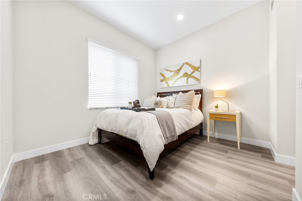 67 Plateau Irvine, CA 92618 - Photo 24 of 32 a bedroom with a bed and a night stand