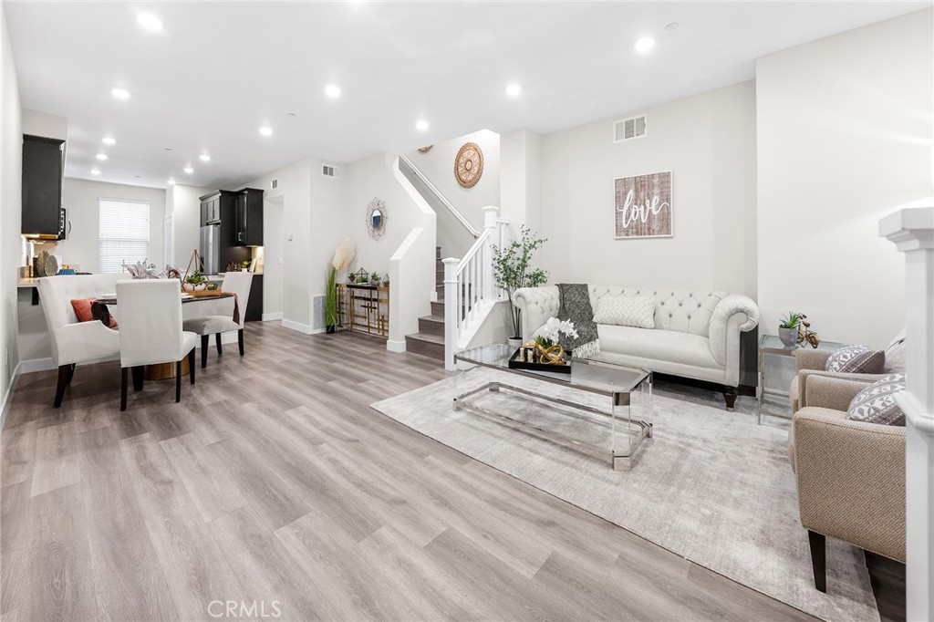 67 Plateau Irvine, CA 92618 - Photo 5 of 32 a living room with furniture and a wooden floor
