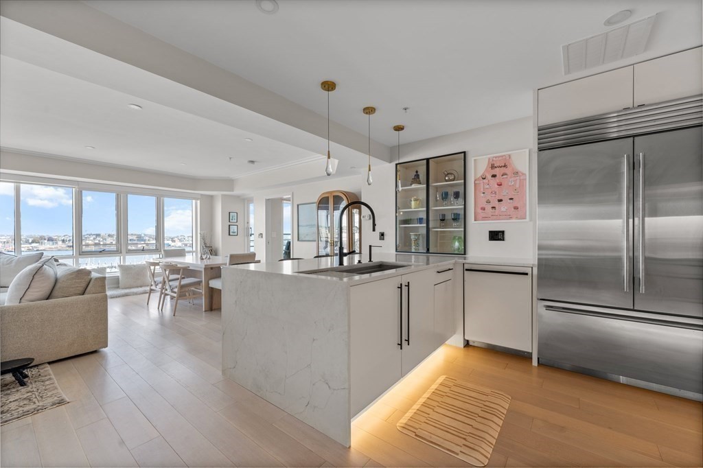 197 8th Street, Unit PH12 Boston, MA 02129 - Photo 11 of 42 a kitchen with counter top space and stainless steel appliances