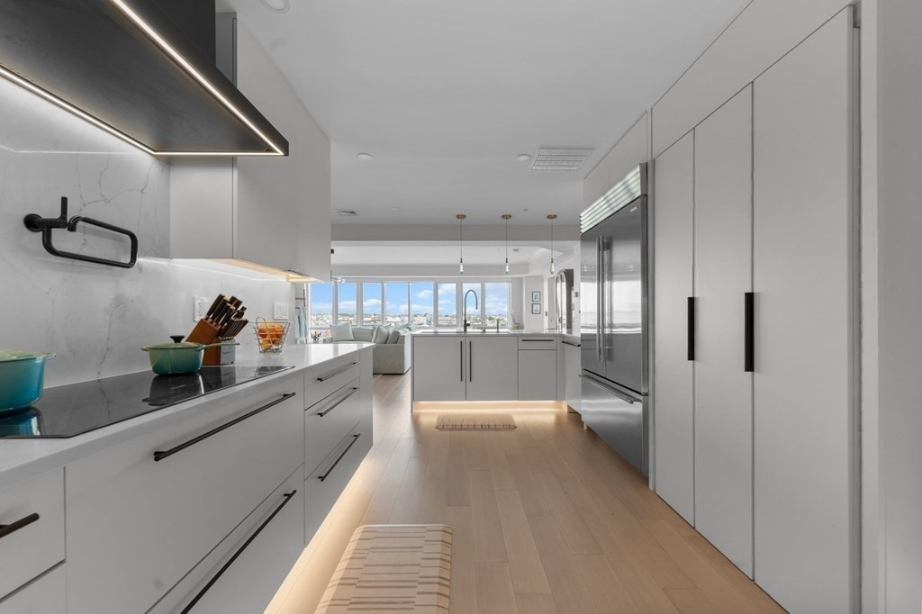 197 8th Street, Unit PH12 Boston, MA 02129 - Photo 13 of 42 a kitchen with stainless steel appliances a refrigerator and a sink