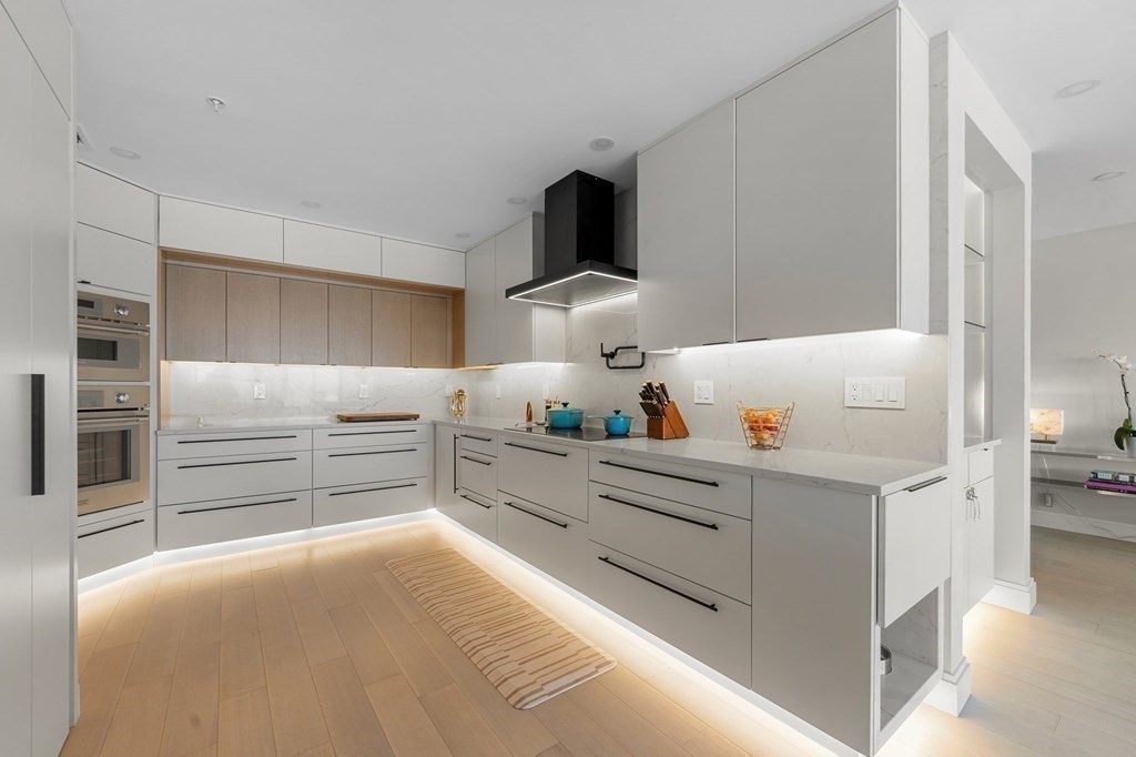 197 8th Street, Unit PH12 Boston, MA 02129 - Photo 15 of 42 a kitchen with stainless steel appliances a refrigerator and a stove