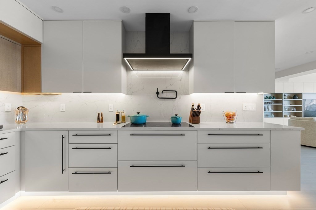 197 8th Street, Unit PH12 Boston, MA 02129 - Photo 17 of 42 a kitchen with cabinets appliances and a sink