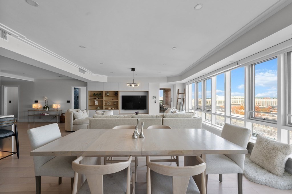 197 8th Street, Unit PH12 Boston, MA 02129 - Photo 22 of 42 a kitchen with a dining table and chairs