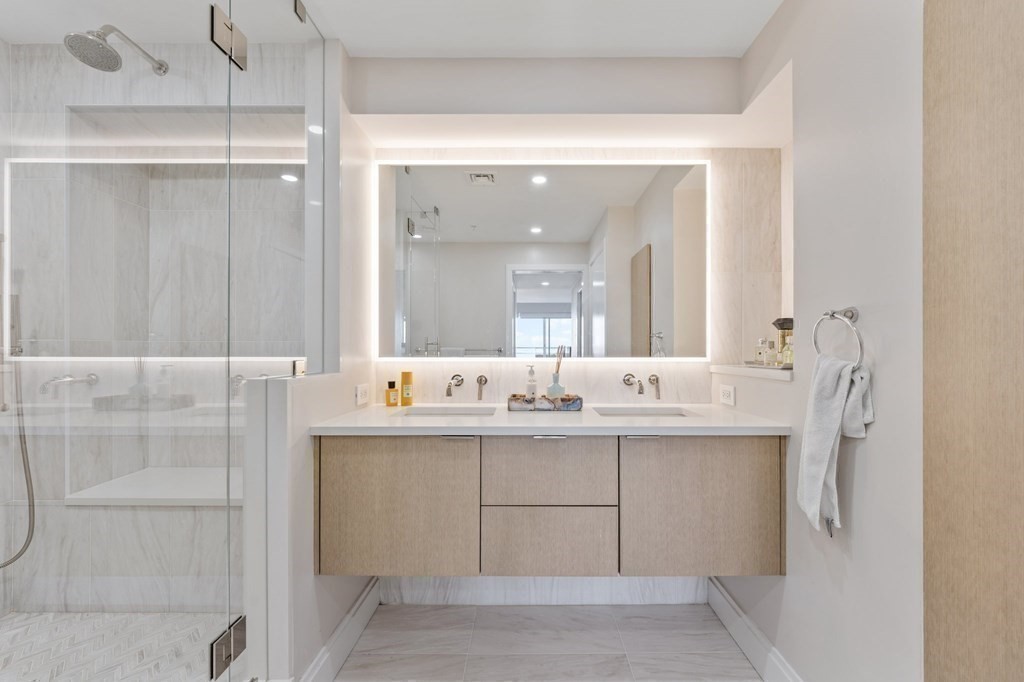 197 8th Street, Unit PH12 Boston, MA 02129 - Photo 28 of 42 a bathroom with a double vanity sink mirror and