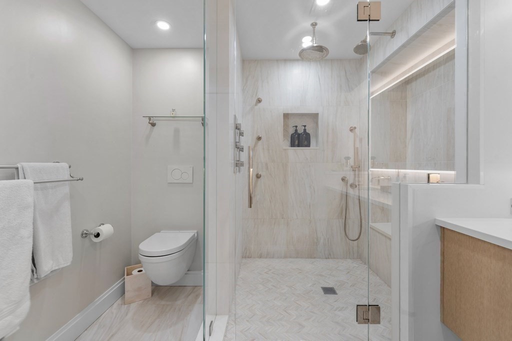 197 8th Street, Unit PH12 Boston, MA 02129 - Photo 29 of 42 a bathroom with a shower toilet and sink