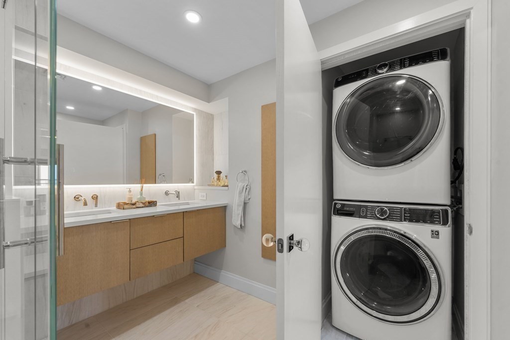 197 8th Street, Unit PH12 Boston, MA 02129 - Photo 30 of 42 a view of a hallway with washer and dryer