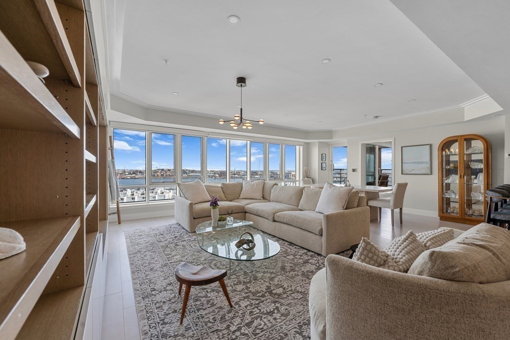 197 8th Street, Unit PH12 Boston, MA 02129 - Photo 3 of 42 a living room with furniture and a rug