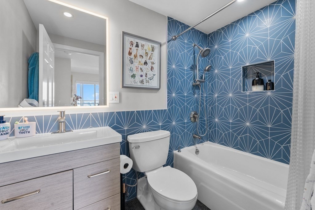 197 8th Street, Unit PH12 Boston, MA 02129 - Photo 37 of 42 a bathroom with a toilet a sink and a bathtub