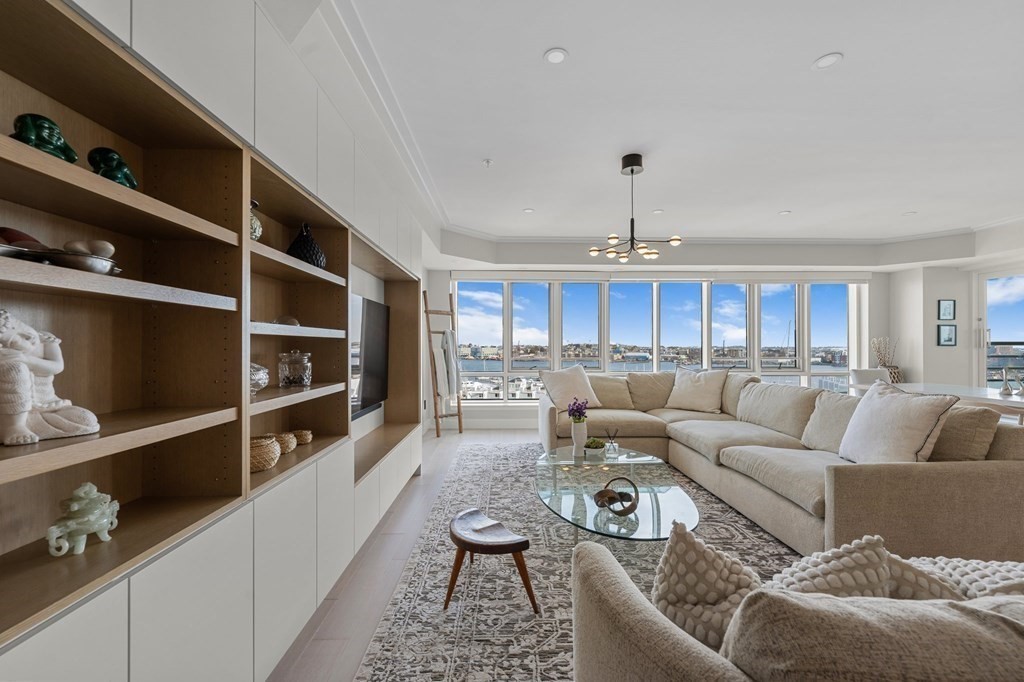 197 8th Street, Unit PH12 Boston, MA 02129 - Photo 4 of 42 a living room with furniture kitchen and a window