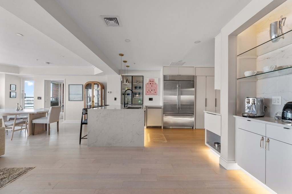197 8th Street, Unit PH12 Boston, MA 02129 - Photo 10 of 42 a view of a living room kitchen and a sink
