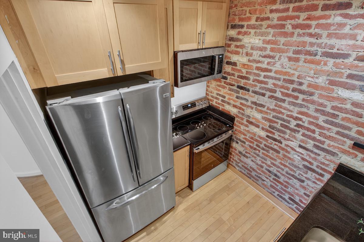1810 California Street Northwest, Unit 202 Washington, DC 20009 - Photo 15 of 52 Charming kitchen with exposed brick.