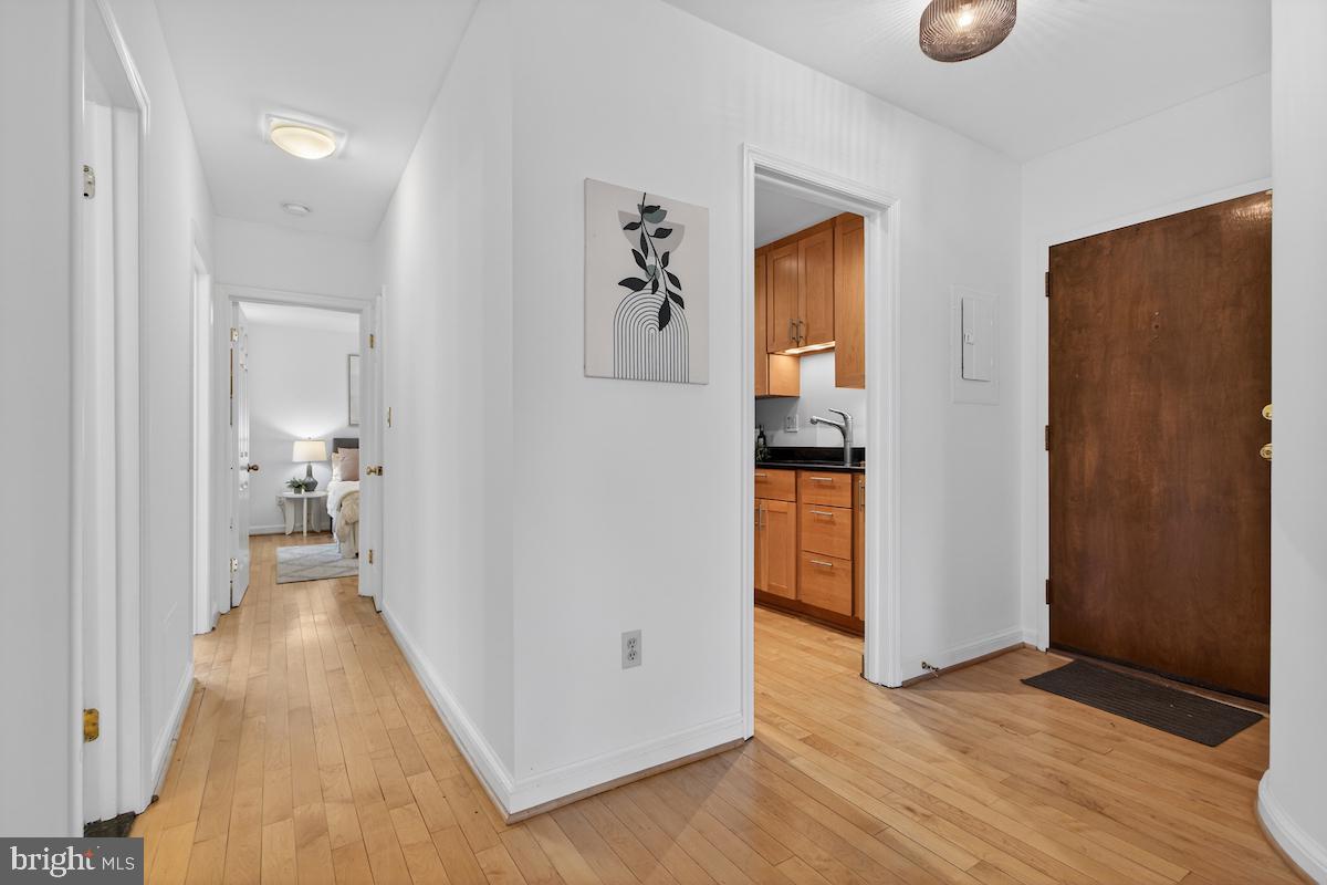 1810 California Street Northwest, Unit 202 Washington, DC 20009 - Photo 17 of 52 Inviting hallway with warm wood floors.
